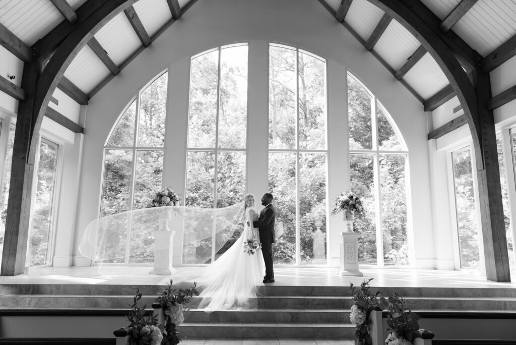 Inerracial couple poses in the chapel at Ashton Gardens in Atlanta, GA