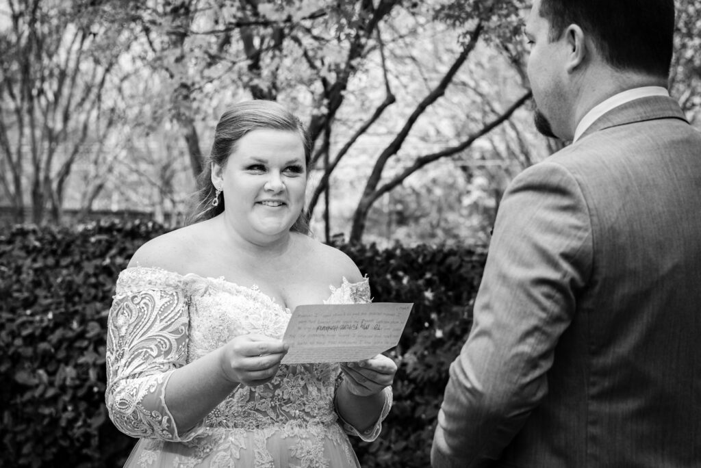 Bride cries while she reads her vows to her groom